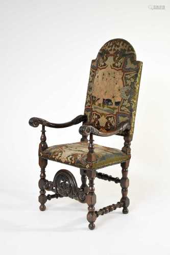 A 17th century carved oak upholstered open armchair, probabl...