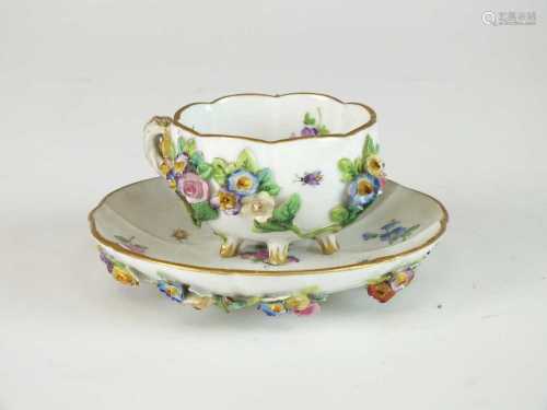A Meissen relief-moulded cabinet cup and saucer
