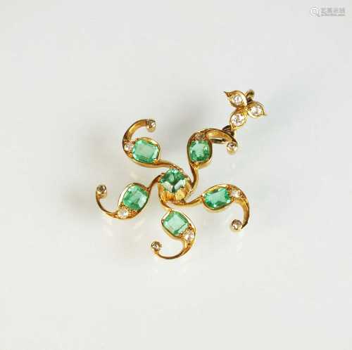 An emerald and diamond stylised star pendant