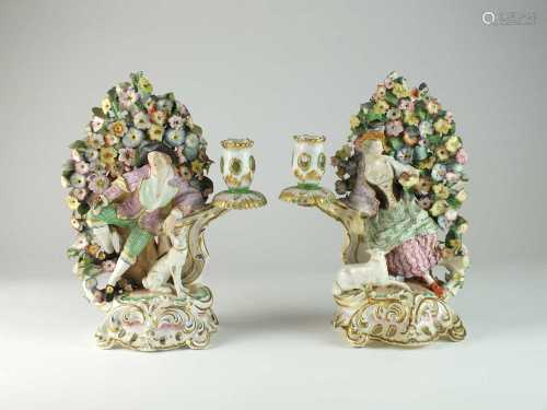A pair of John Bevington bocage candlestick figures