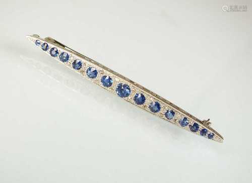 A Victorian style graduated sapphire and diamond line brooch