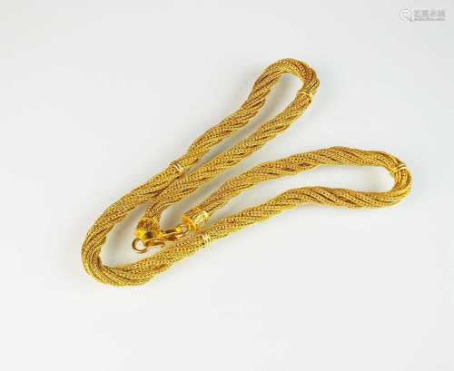 A yellow metal multi-strand rope twist chain necklace