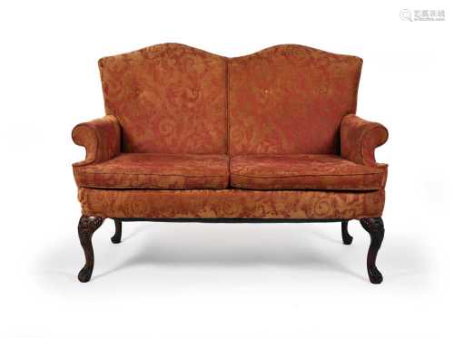 A pair of 18th century style camel back sofas
