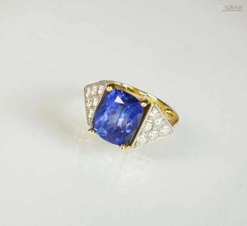 An 18ct gold tanzanite and diamond dress ring, designed as a...