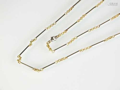 A platinum and yellow metal chain necklace