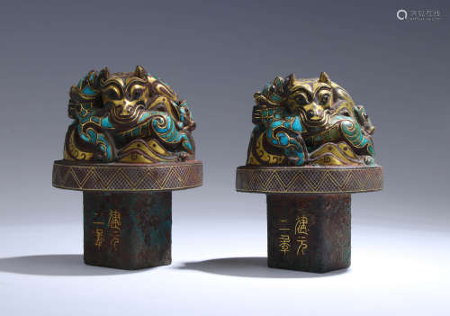 A Pair Of Turquoise, Silver And Gold Inlaid Beast-Form Ornam...