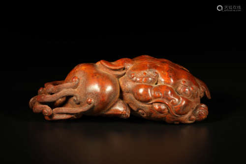 A Carved Bamboo Lion-Form Ornament