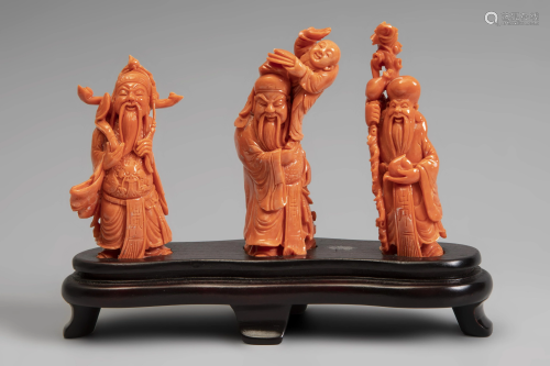 Three Buddhist gods. China. s.XX. Coral. Wood base.