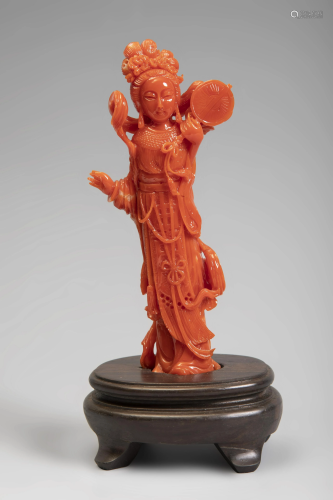 Standing beauty. China, 20th century. Coral. Wooden