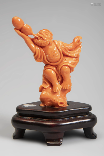 Chinese figure, 20th century. Coral. Wooden base.