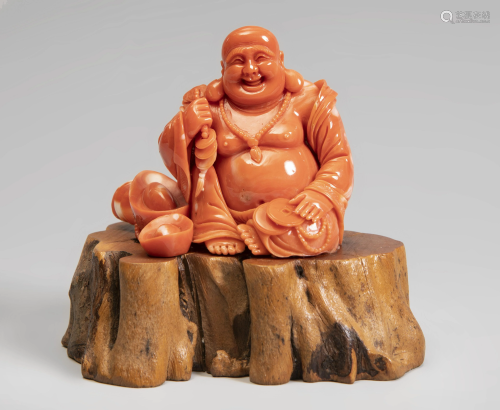 Smiling Buddha. China, 20th century. Coral. Wooden
