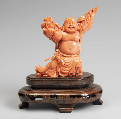 Smiling Buddha. China, 20th century. Coral. Carved