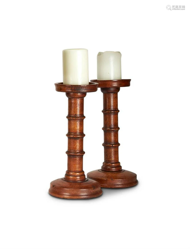 A PAIR OF TURNED AND STAINED WOOD PRICKET CANDLES…