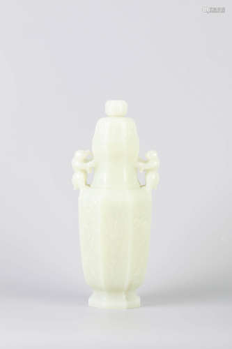 A Carved White Jade Boy Hexagonal Vase And Cover