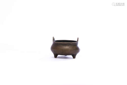 A Bronze Double-Eared Tripod Censer