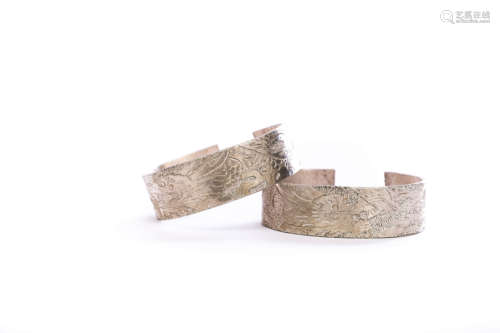 A Pair Of Incised Silver Bangles