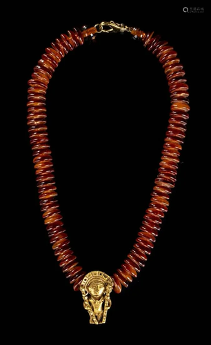 A NECKLACE WITH A GOLD ALLOY ANTHROPOMORPHIC PENDA…