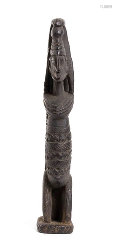 A WOOD SCULPTURE OF A KNEELING FIGURE Mali, Dogon