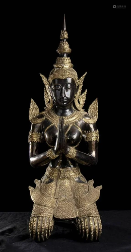 A PARTIALLY GILT BRONZE DEITY Thailand, 20th century