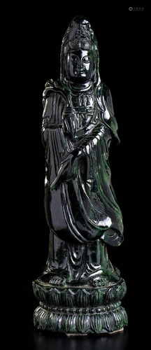 A GREEN STONE STANDING GUANYIN China, 20th century