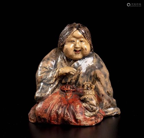 A GLAZED AND PAINTED CERAMIC SCULPTURE OF OKAME W…