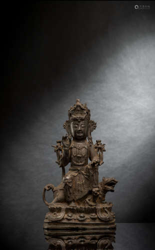 Bronze des Guanyin auf einem  Löwen mit Spuren von Fassung
