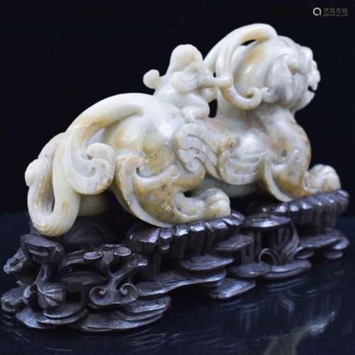 CARVED JADE QILIN SCLUPTURE ON STAND