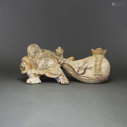 A CHINESE CARVED TANXIANG FIGURE