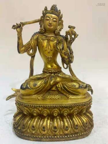 A BRONZE ALLOY FIGURE OF GUANYIN