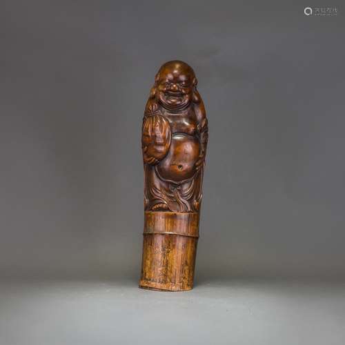 A BAMBOO CARVED FIGURE OF BUDDHA