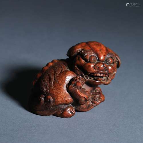 A Carved Bamboo Lion Group Ornament