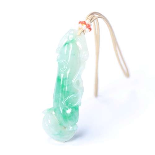 A Carved Jadeite Pendant