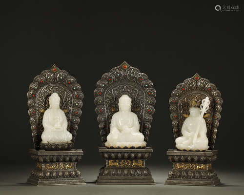 QING DYNASTY,A SET OF WHITE JADE BUDDHAS AND SILVER BASE