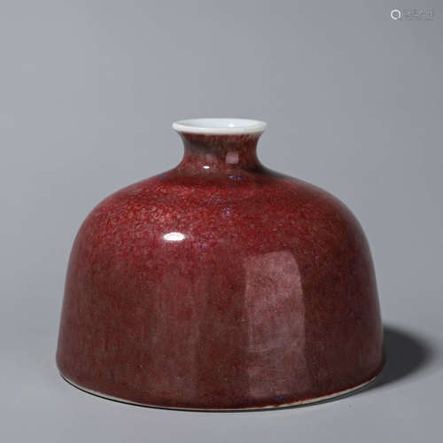 A red glazed porcelain zun