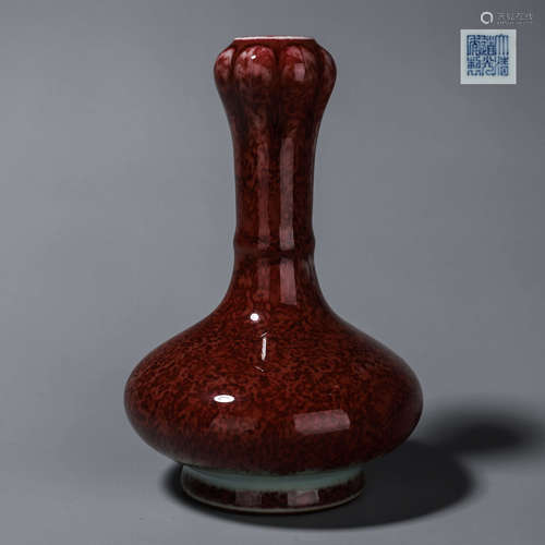 A red glazed porcelain vase