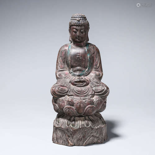 A rosewood carved buddha statuette