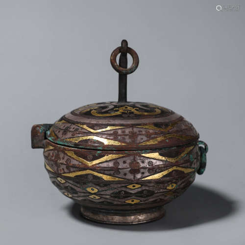 A carved bronze lamp