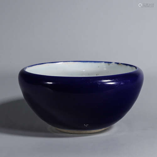 A deep blue glazed porcelain bowl