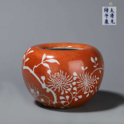 A red glazed white flower porcelain water pot