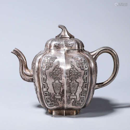 A dragon patterned silver pot