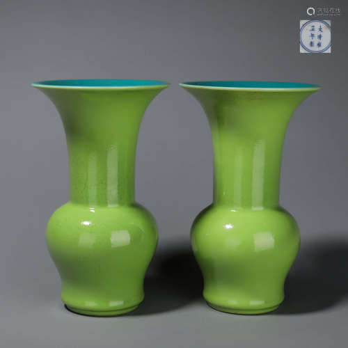 A pair of green glazed porcelain beaker vases