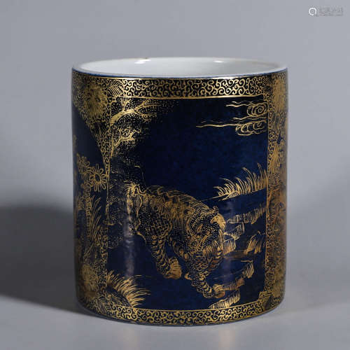 A blue glaze gilt beast and plant porcelain brush pot