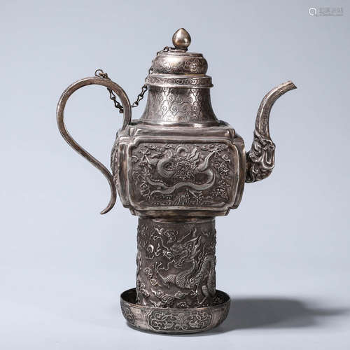 A dragon patterned silver pot