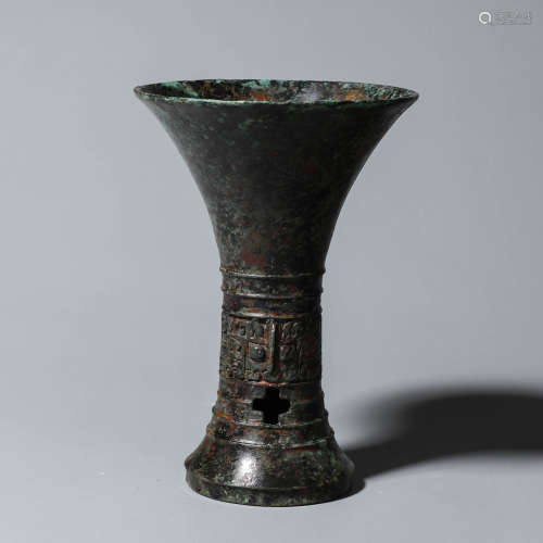 A taotie patterned bronze beaker vase