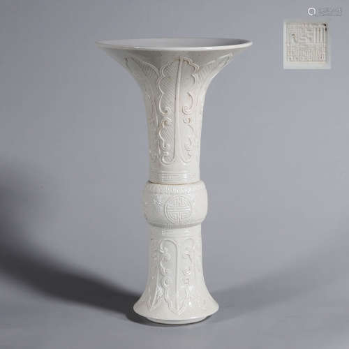 A white glazed porcelain beaker vase