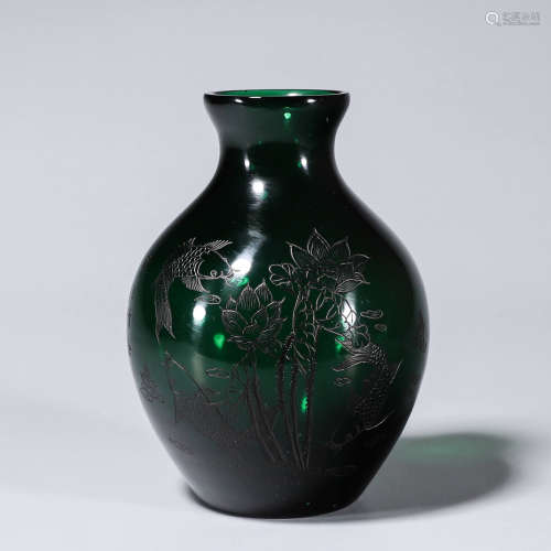 A lotus and fish patterned glass vase