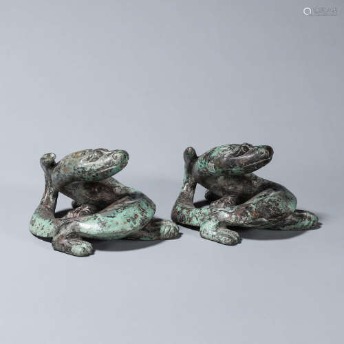 A pair of bronze dragon mat weights