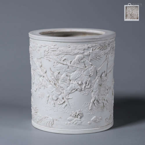 A carved porcelain brush pot