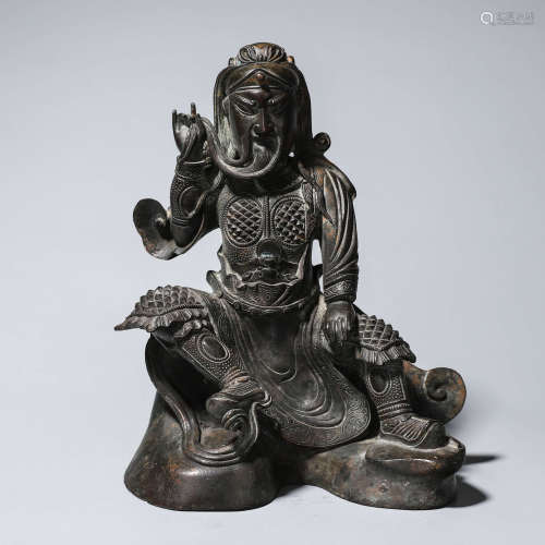 A copper carved Guangong statue
