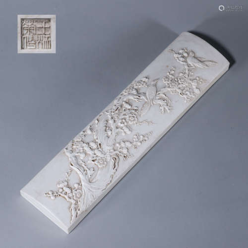 A carved magpie and plum blossom porcelain arm stand